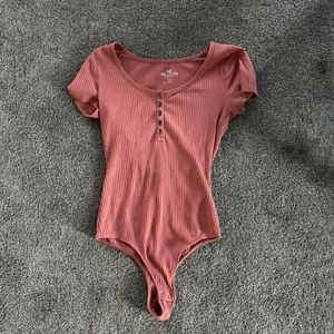 Super cute pink body suit